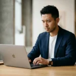 John gardner ford concept image showing a professional man working in a modern office with a focused and thoughtful expression