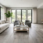 Modern living room featuring grand collection sterling floorinh with elegant gray wood textures and luxury décor